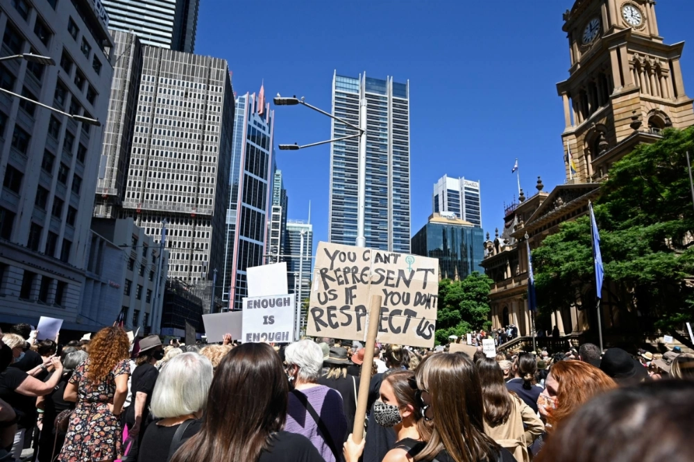 People demonstrate in Sydney in March 2021 in response to the treatment of women in politics as part of the Women's March 4 Justice, a series of protest events. People demonstrate in Sydney in March 2021 in response to the treatment of women in politics as part of the Women's March 4 Justice, a series of protest events.
