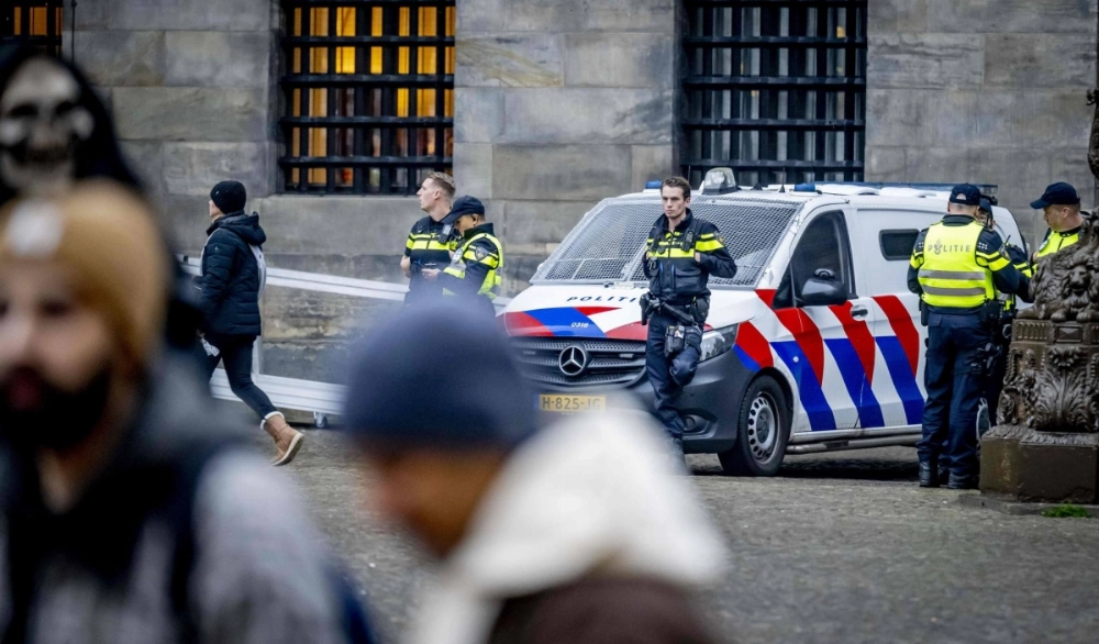 Dutch Police officers patrol on Dam Square in Amsterdam on Saturday.  Dutch Police officers patrol on Dam Square in Amsterdam on Saturday.