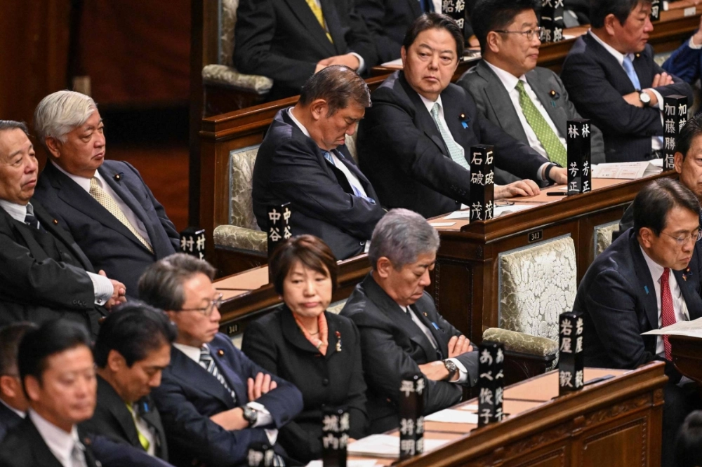 Prime Minister Shigeru Ishiba and other Cabinet members and lawmakers attend a session of the Lower House of parliament in Tokyo on Monday. Prime Minister Shigeru Ishiba and other Cabinet members and lawmakers attend a session of the Lower House of parliament in Tokyo on Monday.