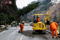 Workers repair a damaged road on Jan. 7 in the aftermath of an earthquake in Wajima, Ishikawa Prefecture. | Reuters