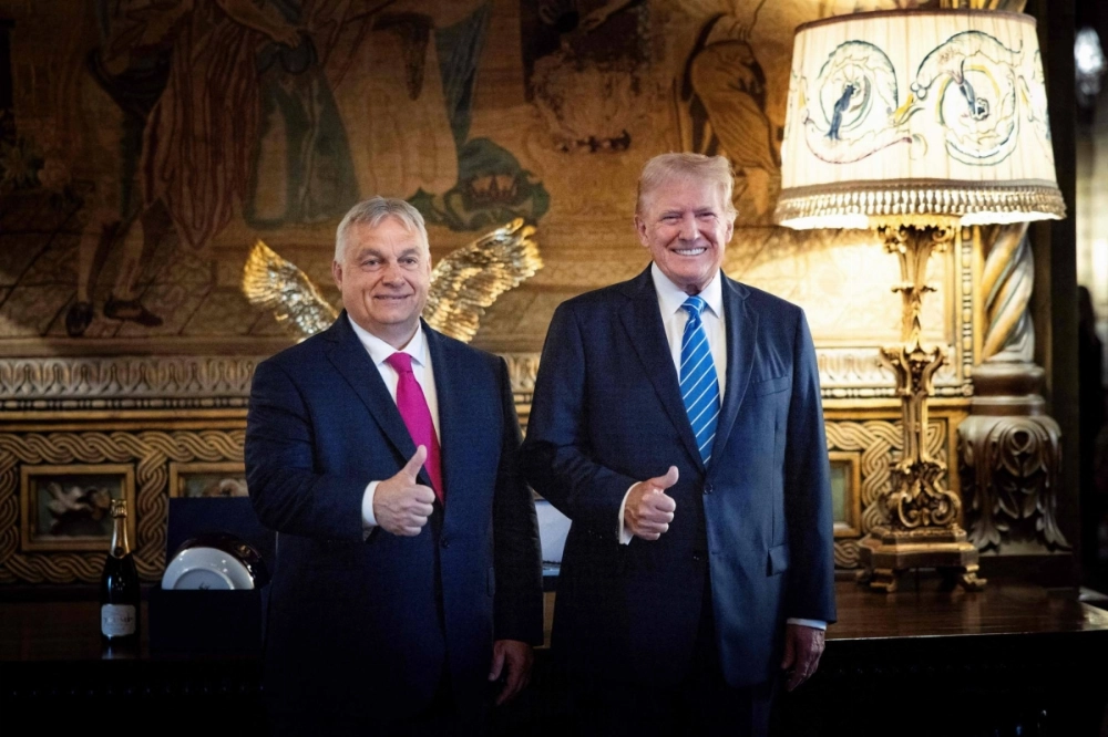Hungarian Prime Minister Viktor Orban (L) poses with Donald Trump in Palm Beach, Florida, on July 11. Hungarian Prime Minister Viktor Orban (L) poses with Donald Trump in Palm Beach, Florida, on July 11.