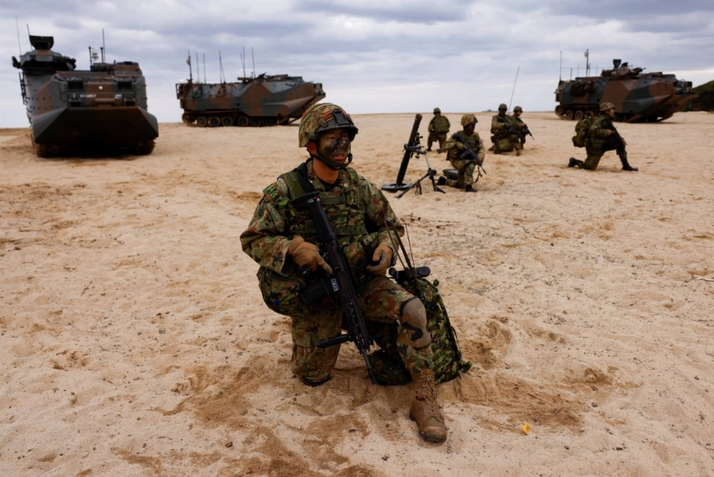 Troops from the Ground Self-Defense Force's Amphibious Rapid Deployment Brigade take part in a marine landing drill as a part of the country's nationwide 05JX military exercises in Kagoshima Prefecture in November of last year. Troops from the Ground Self-Defense Force's Amphibious Rapid Deployment Brigade take part in a marine landing drill as a part of the country's nationwide 05JX military exercises in Kagoshima Prefecture in November of last year.