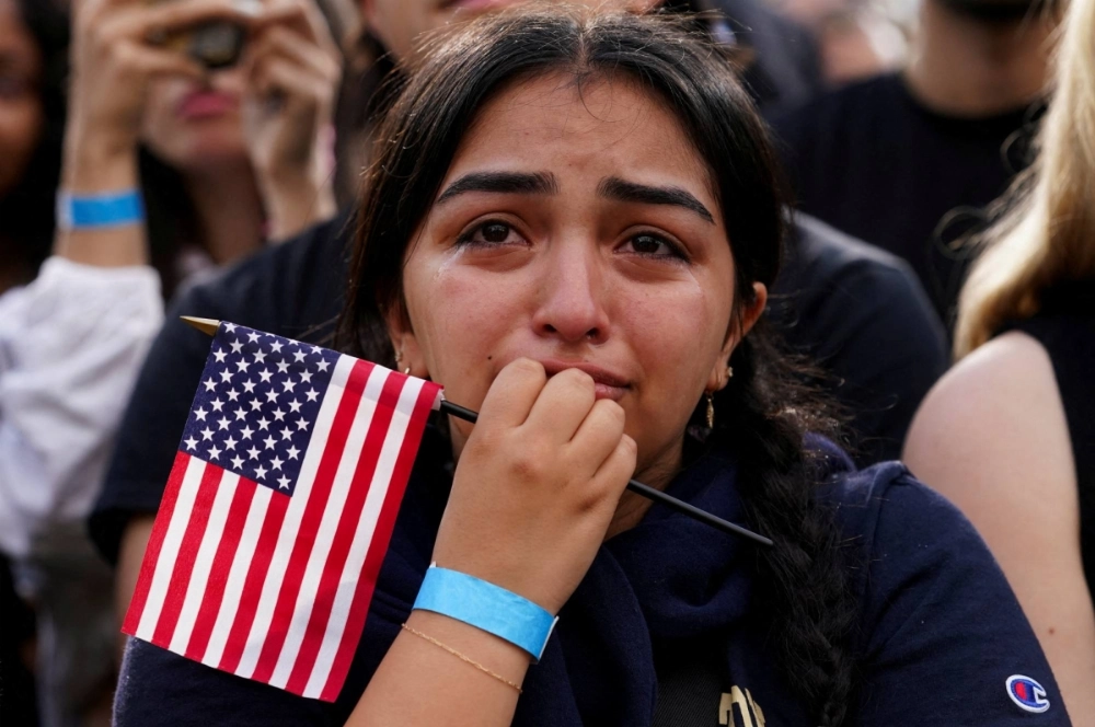 A Kamala Harris supporter listens as the Democratic presidential nominee concedes the 2024 U.S. presidential election to President-elect Donald Trump at Howard University in Washington on Nov 6. 2024.
 A Kamala Harris supporter listens as the Democratic presidential nominee concedes the 2024 U.S. presidential election to President-elect Donald Trump at Howard University in Washington on Nov 6. 2024.