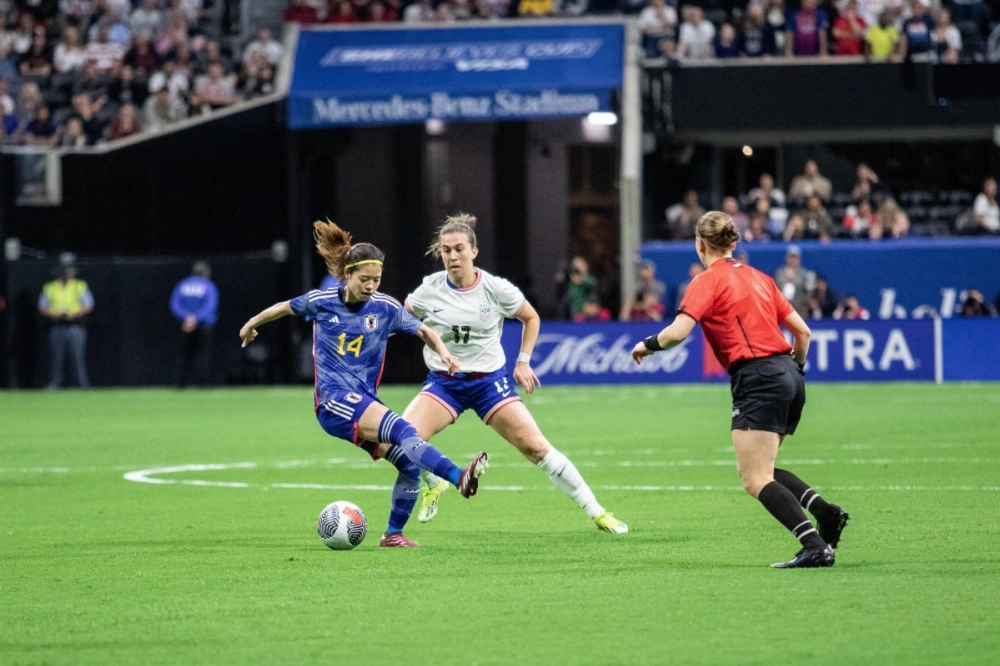 United States midfielder Sam Coffey (17) battles Japan forward Yui Hasegawa (14) during the SheBelieves Cup in Atlanta in April.  United States midfielder Sam Coffey (17) battles Japan forward Yui Hasegawa (14) during the SheBelieves Cup in Atlanta in April.