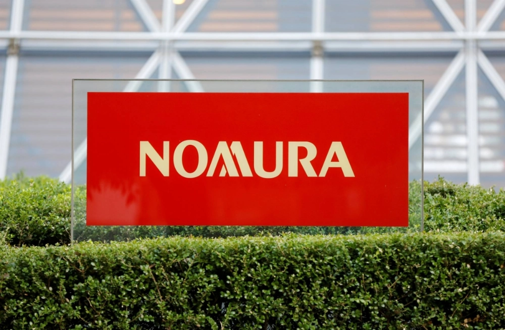 A former Nomura Holdings employee has been charged on suspicion of robbery, attempted murder and arson of an inhabited building, the firm said in a statement on Wednesday. A former Nomura Holdings employee has been charged on suspicion of robbery, attempted murder and arson of an inhabited building, the firm said in a statement on Wednesday.