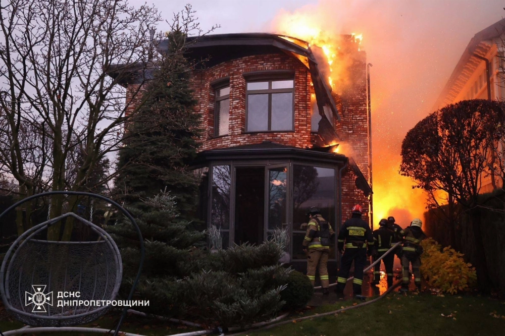 Ukrainian firefighters work on a spot following an airstrike in Dnipro on Thursday. Ukrainian firefighters work on a spot following an airstrike in Dnipro on Thursday.