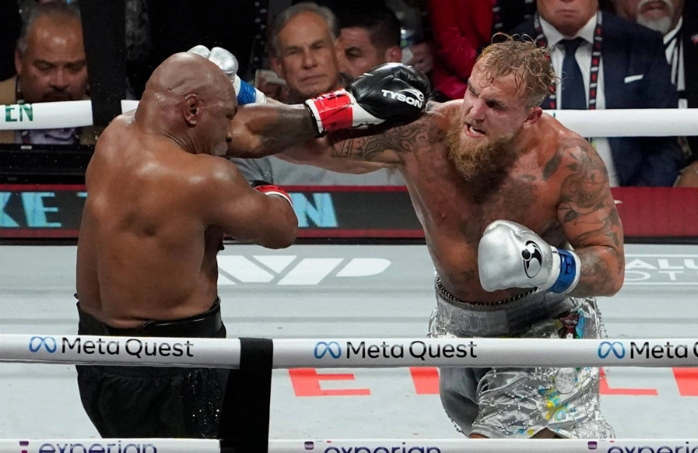 Retired pro-boxer Mike Tyson and YouTuber/boxer Jake Paul fight during the heavyweight boxing bout in Arlington, Texas, on Nov. 15. The fight highlights the need for a national boxing commission to enforce uniform safety standards and prevent exploitative matchups. Retired pro-boxer Mike Tyson and YouTuber/boxer Jake Paul fight during the heavyweight boxing bout in Arlington, Texas, on Nov. 15. The fight highlights the need for a national boxing commission to enforce uniform safety standards and prevent exploitative matchups.
