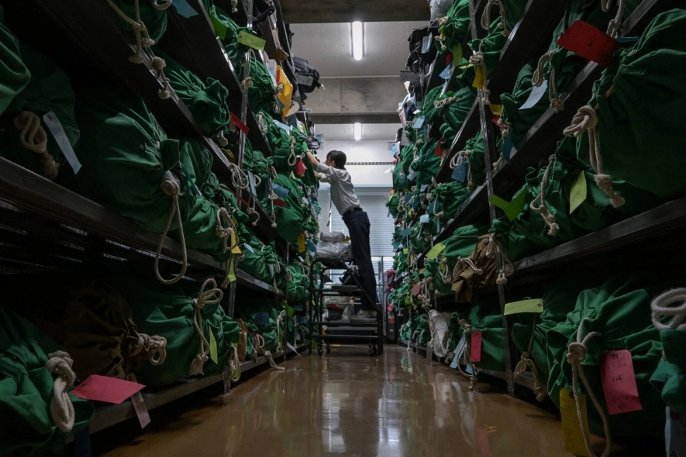 An employee at the Tokyo Metropolitan Police Department Lost and Found Center in the Iidabashi area of central Tokyo bags, tags and organizes thousands of items. An employee at the Tokyo Metropolitan Police Department Lost and Found Center in the Iidabashi area of central Tokyo bags, tags and organizes thousands of items.