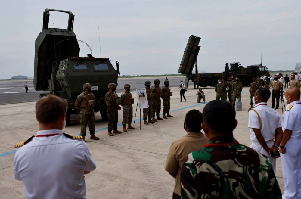 A U.S. Marine Corps M142 High Mobility Artillery Rocket System (HIMARS) and a Japanese Ground Self-Defense Force Type 12 Surface-to-Ship Missile (12SSM) system are put on display at a symposium at a base in Kisarazu, Japan, in June 2022.  A U.S. Marine Corps M142 High Mobility Artillery Rocket System (HIMARS) and a Japanese Ground Self-Defense Force Type 12 Surface-to-Ship Missile (12SSM) system are put on display at a symposium at a base in Kisarazu, Japan, in June 2022.