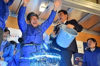 Ichiro Hirosawa (left) celebrates his victory in the Nagoya mayoral election in Nagoya on Sunday along with former Nagoya Mayor Takashi Kawamura (right). | Jiji