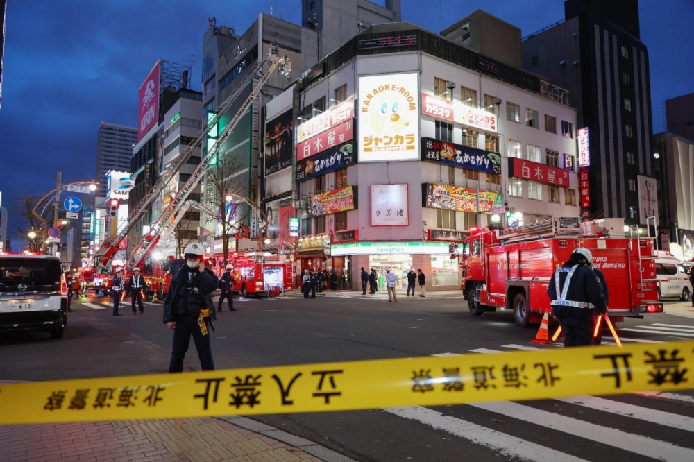 Firetrucks outside a building in Sapporo where an explosion left four people injured on Tuesday. Firetrucks outside a building in Sapporo where an explosion left four people injured on Tuesday.