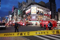Firetrucks outside a building in Sapporo where an explosion left four people injured on Tuesday. | Jiji