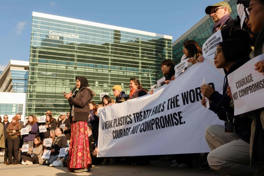 Environmental activists demonstrate in front of the convention center in Busan, South Korea, where delegates from around the world are seeking to reach a binding treaty against plastic waste.  Environmental activists demonstrate in front of the convention center in Busan, South Korea, where delegates from around the world are seeking to reach a binding treaty against plastic waste.