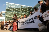 Environmental activists demonstrate in front of the convention center in Busan, South Korea, where delegates from around the world are seeking to reach a binding treaty against plastic waste.  | AFP-JIJI