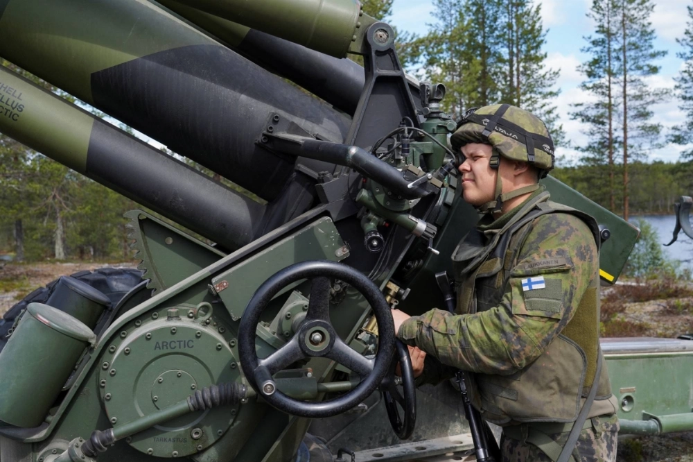 A Finnish soldier operates a towed 155 mm field gun during the Northern Forest land force exercise in Rovajarvi, Finland, in May 2023. A Finnish soldier operates a towed 155 mm field gun during the Northern Forest land force exercise in Rovajarvi, Finland, in May 2023.