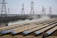 Workers install solar panels at the Adani Group-owned Khavda Renewable Energy Park in Khavda, India, on Jan. 12.  | AFP-JIJI
