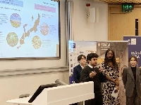 Students give a presentation at a competition in London on Friday for revitalization strategies in the Hokuriku region | Jiji