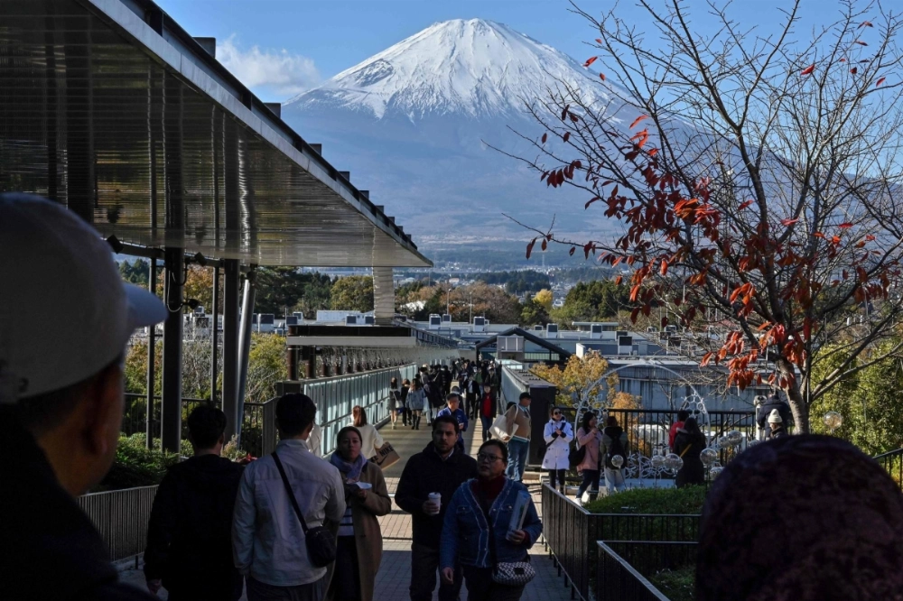 People walk around an outlet mall in Gotemba, Shizuoka Prefecture. At stores across Japan, clerks use a form of polite language called "manyuaru keigo," literally, “manual honorifics,” named for the service manuals they study it from.   People walk around an outlet mall in Gotemba, Shizuoka Prefecture. At stores across Japan, clerks use a form of polite language called "manyuaru keigo," literally, “manual honorifics,” named for the service manuals they study it from.