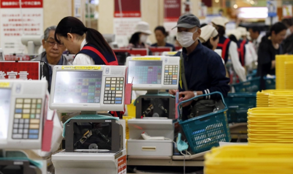 Shoppers wait at the checkout lines at an Ito-Yokado shopping centre after a sales tax hike in Tokyo April 1, 2014. Big firms expect to increase capital spending only modestly, the Bank of Japan's (BOJ) tankan quarterly survey showed on Tuesday, reflecting uncertainty over how much a sales tax hike that kicked off on Tuesday could hurt a fragile economic recovery.   REUTERS/Toru Hanai (JAPAN - Tags: BUSINESS) Shoppers wait at the checkout lines at an Ito-Yokado shopping centre after a sales tax hike in Tokyo April 1, 2014. Big firms expect to increase capital spending only modestly, the Bank of Japan's (BOJ) tankan quarterly survey showed on Tuesday, reflecting uncertainty over how much a sales tax hike that kicked off on Tuesday could hurt a fragile economic recovery.   REUTERS/Toru Hanai (JAPAN - Tags: BUSINESS)