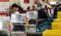 Shoppers wait at the checkout lines at an Ito-Yokado shopping centre after a sales tax hike in Tokyo April 1, 2014. Big firms expect to increase capital spending only modestly, the Bank of Japan's (BOJ) tankan quarterly survey showed on Tuesday, reflecting uncertainty over how much a sales tax hike that kicked off on Tuesday could hurt a fragile economic recovery.   REUTERS/Toru Hanai (JAPAN - Tags: BUSINESS) | Shoppers wait at the checkout lines at an Ito-Yokado shopping centre after a sales tax hike in Tokyo April 1, 2014. Big firms expect to increase capital spending only modestly, the Bank of Japan's (BOJ) tankan quarterly survey showed on Tuesday, reflecting uncertainty over how much a sales tax hike that kicked off on Tuesday could hurt a fragile economic recovery.   REUTERS/Toru Hanai (JAPAN - Tags: BUSINESS)
Shoppers wait at the checkout lines at an ItoYokado shopping centre after a sales tax hike in Tokyo
