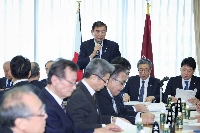 Prime Minister Shigeru Ishiba addresses a Liberal Democratic Party meeting of regional chapter secretaries-generals in Tokyo on Sunday. | Jiji