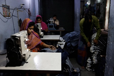 Factory workers make jeans in Dhaka in March 2023.  Factory workers make jeans in Dhaka in March 2023.