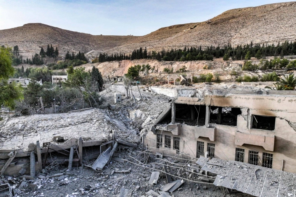 The aftermath of an overnight strike attributed to Israel is seen on the Barzeh scientific research center affiliated with the Syrian defense ministry in northern Damascus on Tuesday. The aftermath of an overnight strike attributed to Israel is seen on the Barzeh scientific research center affiliated with the Syrian defense ministry in northern Damascus on Tuesday.