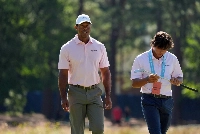 Tiger Woods and his son Charlie Woods walk off the seventh green during a practice round for the U.S. Open golf tournament in Pinehurst, North Carolina, on June 11. | USA TODAY / via Reuters