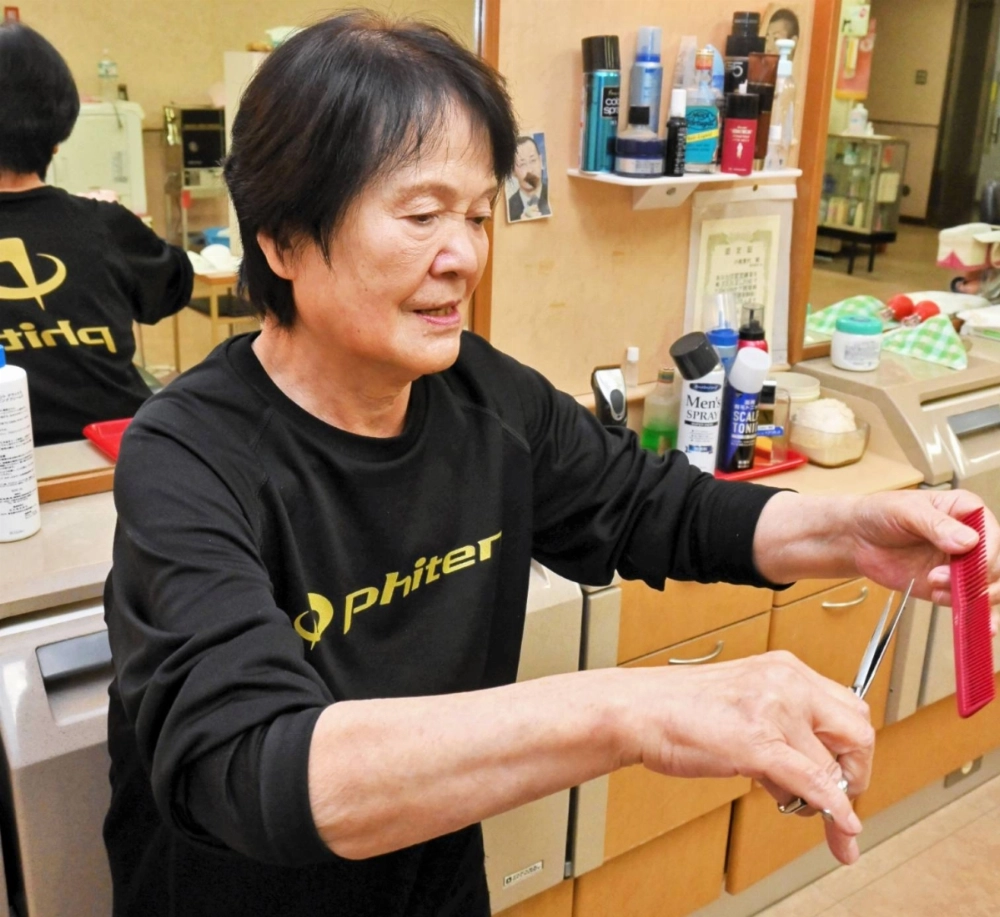 Satoyo Kojika, who has run a barbershop inside the parliament building for more than half a century Satoyo Kojika, who has run a barbershop inside the parliament building for more than half a century