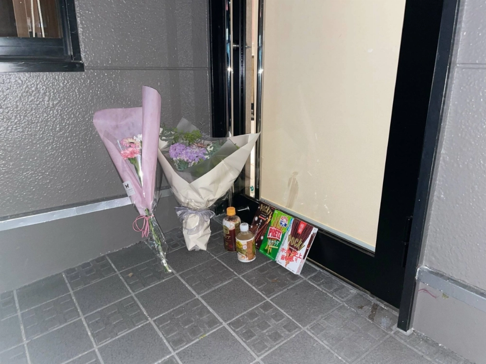 Flowers and offerings are placed outside a McDonald's restaurant in Kitakyushu, Fukuoka Prefecture, where two junior high school students were stabbed by a man on Saturday, one fatally. Flowers and offerings are placed outside a McDonald's restaurant in Kitakyushu, Fukuoka Prefecture, where two junior high school students were stabbed by a man on Saturday, one fatally.