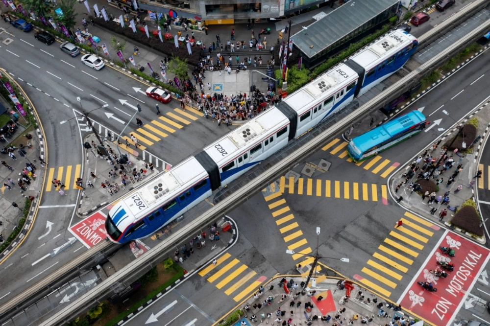 A train passes over downtown Kuala Lumpur  A train passes over downtown Kuala Lumpur