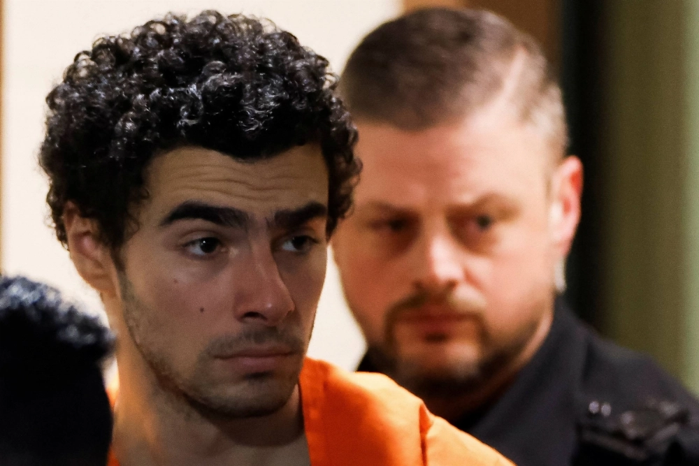 Luigi Mangione, 26, at the Blair County Courthouse in Hollidaysburg, Pennsylvania, on Dec. 10. Mangione was indicted on Tuesday for the murder of UnitedHealth Group executive Brian Thompson. Luigi Mangione, 26, at the Blair County Courthouse in Hollidaysburg, Pennsylvania, on Dec. 10. Mangione was indicted on Tuesday for the murder of UnitedHealth Group executive Brian Thompson.