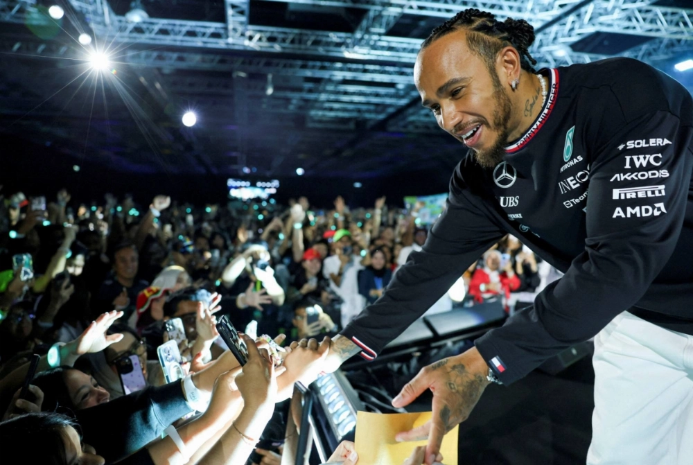 Lewis Hamilton greets fans during a farewell event with Mercedes in Kuala Lumpur, on Dec. 10. Lewis Hamilton greets fans during a farewell event with Mercedes in Kuala Lumpur, on Dec. 10.