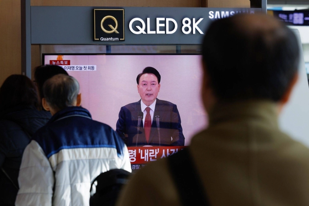 South Korean President Yoon Suk Yeol appears on a screen in Seoul on Wednesday. South Korean President Yoon Suk Yeol appears on a screen in Seoul on Wednesday.