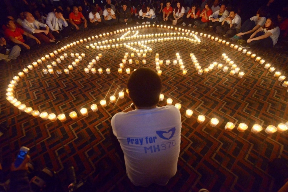 Chinese relatives of passengers on the missing Malaysia Airlines Flight 370 take part in a prayer service at the Metro Park Hotel in Beijing on April 8, 2014. The plane, which departed from Kuala Lumpur on March 8, 2014, was to have flown to Beijing. Chinese relatives of passengers on the missing Malaysia Airlines Flight 370 take part in a prayer service at the Metro Park Hotel in Beijing on April 8, 2014. The plane, which departed from Kuala Lumpur on March 8, 2014, was to have flown to Beijing.