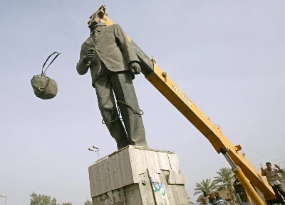 Protesters behead a statue of Saddam Hussein's predecessor, Ahmad Hassan al-Bakr, president of Iraq from 1968 to 1979, in Baghdad's al-Mansur district in May 2003, erasing one of the last symbols of the Baath Party's 35-year regime. Protesters behead a statue of Saddam Hussein's predecessor, Ahmad Hassan al-Bakr, president of Iraq from 1968 to 1979, in Baghdad's al-Mansur district in May 2003, erasing one of the last symbols of the Baath Party's 35-year regime.