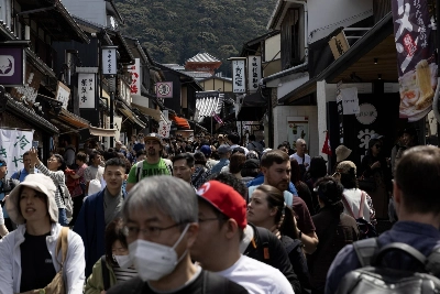 Visitors to Kyoto walk along a street near Kiyomizu Temple in April. A popular tourist spot, Kyoto has seen what locals feel to be an overwhelming amount of tourists in 2024. Visitors to Kyoto walk along a street near Kiyomizu Temple in April. A popular tourist spot, Kyoto has seen what locals feel to be an overwhelming amount of tourists in 2024.