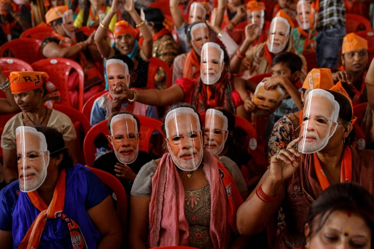 Supporters of India's Prime Minister Narendra Modi wear masks of his face at an election campaign rally in Meerut, India, on March 31. Modi and his Bharatiya Janata Party won the most seats in the election, which was held between April and June, for the third consecutive time. However, he fell short of a majority in India’s lower house of Parliament. Supporters of India's Prime Minister Narendra Modi wear masks of his face at an election campaign rally in Meerut, India, on March 31. Modi and his Bharatiya Janata Party won the most seats in the election, which was held between April and June, for the third consecutive time. However, he fell short of a majority in India’s lower house of Parliament.