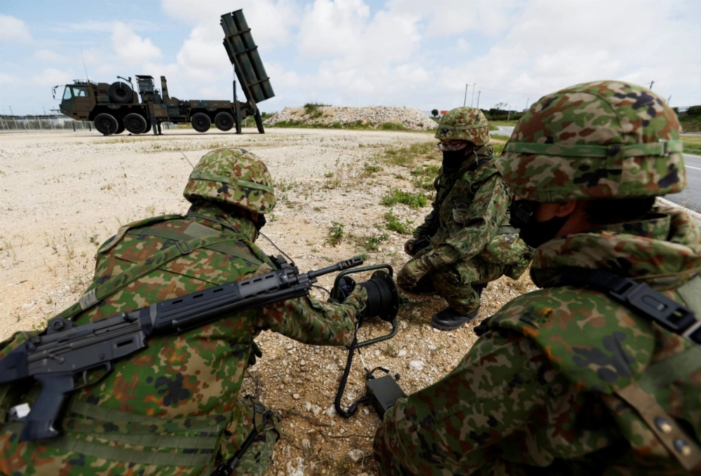 Ground Self-Defense Force members conduct a military drill next to an anti-ship missile unit on Miyako Island in Okinawa Prefecture in April 2022. Ground Self-Defense Force members conduct a military drill next to an anti-ship missile unit on Miyako Island in Okinawa Prefecture in April 2022.