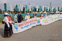 Climate activists hold banners outside the venue of the COP29 climate conference in Baku, Azerbaijan. | Bloomberg