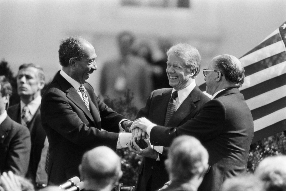 From left: President Anwar el-Sadat of Egypt, President Jimmy Carter and Prime Minister Menachem Begin of Israel in a three-way handshake after the signing of the peace treaty between Egypt and Israel at the White House in 1979.  From left: President Anwar el-Sadat of Egypt, President Jimmy Carter and Prime Minister Menachem Begin of Israel in a three-way handshake after the signing of the peace treaty between Egypt and Israel at the White House in 1979.