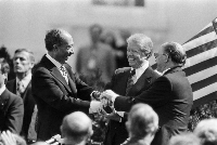 From left: President Anwar el-Sadat of Egypt, President Jimmy Carter and Prime Minister Menachem Begin of Israel in a three-way handshake after the signing of the peace treaty between Egypt and Israel at the White House in 1979.  | Neal Boenzi / The New York Times