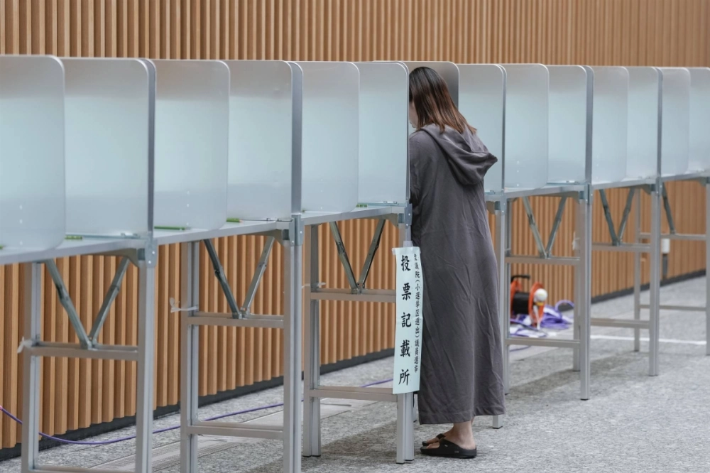 A voter casts a ballot at a polling station in Tokyo on Oct. 27. Last year, incumbents in every major country that held a national election lost that vote, the first time that has happened in almost 120 years. A voter casts a ballot at a polling station in Tokyo on Oct. 27. Last year, incumbents in every major country that held a national election lost that vote, the first time that has happened in almost 120 years.