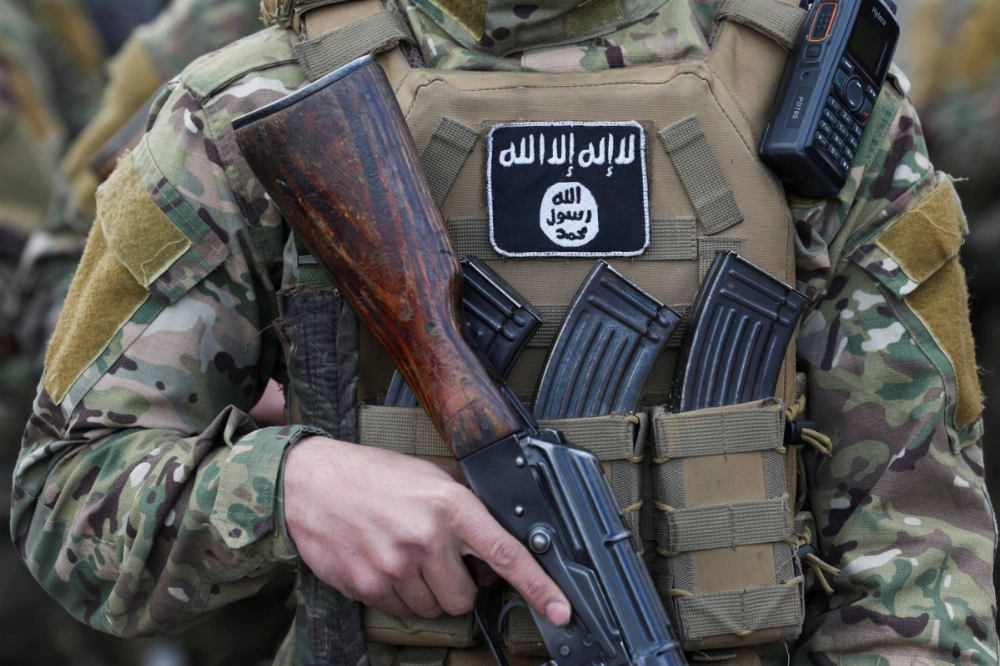 A patch of the Islamic State group is seen on a fighter's uniform in Damascus on Dec. 27, 2024. A patch of the Islamic State group is seen on a fighter's uniform in Damascus on Dec. 27, 2024.