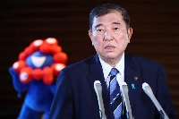 Prime Minister Shigeru Ishiba speaks to reporters in Tokyo Thursday before leaving for a trip to Malaysia and Indonesia. | Jiji