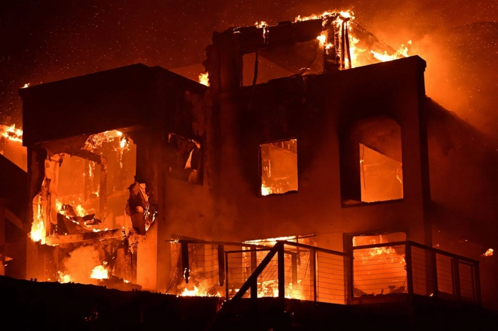 A home is engulfed in flames as the Palisades Fire burns along Pacific Coast Highway in Malibu, California, on Wednesday. A home is engulfed in flames as the Palisades Fire burns along Pacific Coast Highway in Malibu, California, on Wednesday.