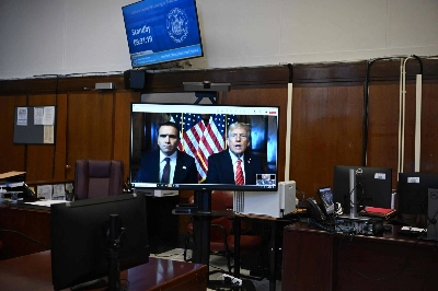 U.S. President-elect Donald Trump appears remotely for a sentencing hearing in front of New York State Judge Juan Merchan in the criminal case in which he was convicted in 2024 on charges involving hush money paid to a porn star, at New York Criminal Court in Manhattan on Friday. U.S. President-elect Donald Trump appears remotely for a sentencing hearing in front of New York State Judge Juan Merchan in the criminal case in which he was convicted in 2024 on charges involving hush money paid to a porn star, at New York Criminal Court in Manhattan on Friday.
