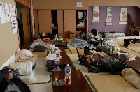 People rest at an evacuation center in the aftermath of Typhoon Hagibis in Date, Fukushima Prefecture, in October 2019. | REUTERS