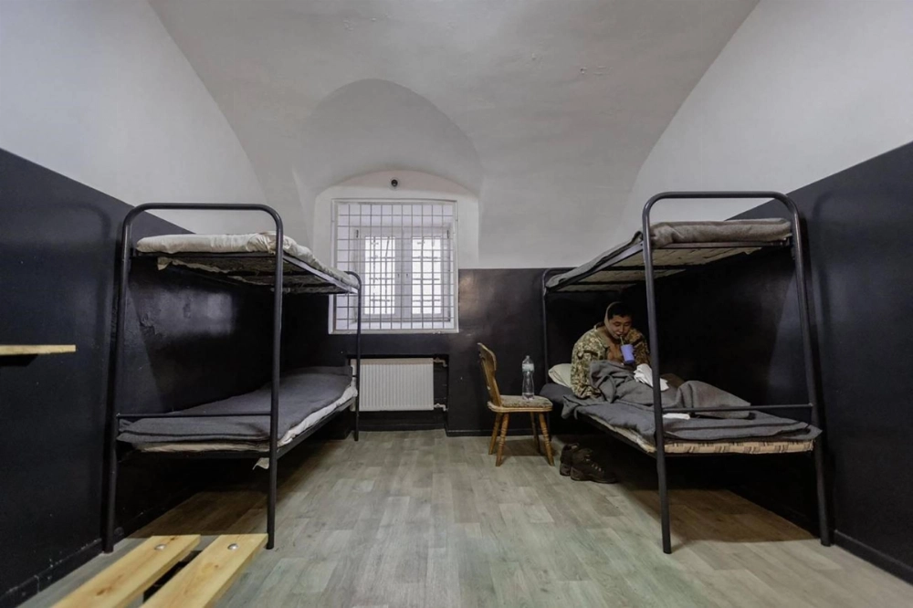 An alleged North Korean soldier sits on a bunk at an undisclosed location in Ukraine following his capture by the Ukrainian army. An alleged North Korean soldier sits on a bunk at an undisclosed location in Ukraine following his capture by the Ukrainian army.
