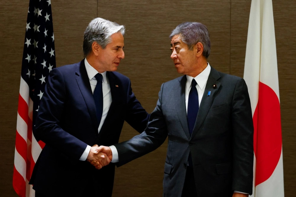 U.S. Secretary of State Antony Blinken shakes hands with Foreign Minister Takeshi Iwaya during a working lunch at a hotel in Tokyo last week. U.S. Secretary of State Antony Blinken shakes hands with Foreign Minister Takeshi Iwaya during a working lunch at a hotel in Tokyo last week.